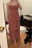 Hit right above my ankles. Dress fit but also didn't. I have a small bust (30B) and could have filled out the cups more on the dress, but the outside layer was a bit too loose and puffy. Decided to return the dress as I didn't love the fit. Color is a little more peachy than the online photos, but still a lovely color. - Emma J.