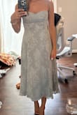 I'm obsessed with this dress! Beautiful design and color. True to size. Straps are real ties. - Monica S.
