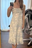 I love this dress! Wearing for engagement photos. True to size. Just FYI, the white is more muted/off white vs a stark true white. They must have updated the style- the straps are luckily true adjustable ties for bows, unlike some of the reviews stating they are fixed. - Monica S.