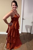 I ordered several dresses for my cousin's wedding and wound up going with a different one. The fit was spot on, and the fabric layers were much more flattering than some of the other pleated dresses I tried. With the color and the way the fabric moved, my boyfriend said I reminded him of Mr. Snuffleupagus, though. - Tammy D.