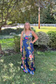 I really like this dress a lot, and the color and pattern are beautiful. I'm a size 8, and the large fits well, but there were a few things that could be improved. As others mentioned, the dress is extremely long. I'm 5'8, and I wore small heels, but I was still tripping over the bottom of this dress. Unless you're 6 feet tall, this dress is going to be long for you! The chest area also fit kind of weird, even though I tightened the straps as tight as I could. If you're pretty busty, it will probably fit better, but it was huge for me as a B cup. Overall, it's a cute dress and it's very comfortable and flattering. - Leanna C.