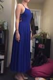 I got this dress and a few others trying to find a good one for a military ball. I got the Royal Blue in Medium and the Black in small. The sizing of this dress was way off, the small was longer than the medium although the small was slightly more snug around my waist. Both sizes were too short in general, showing my full ankle with flats on. The stitching and back laceup was beautiful though. - Kathryn L.