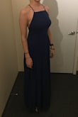 I got this dress in Slate Blue in a M and in Navy in a S trying to find the right dress for a military ball. The Slate Blue hung slightly better on my frame than this one and the blue matched my eyes so I ended up wearing that one instead and selling this one to a friend who was looking for a dress and it fit her beautifully too. The adjustable back straps helped ensure that the seams on the chest fell in all of the right places and that the height was just right with a pair of 3 inch heels. - Kathryn L.