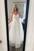 This dress is gorgeous. I feel like an angel. I love how when the sun shines through the tulle you can see the silk slip beneath, truly ethereal. Also extremely comfortable. I bought another address that was mermaid style, and it was so heavy and uncomfortable. I feel like I'm floating in this. - Emily R.