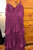 This dress is super cute, except when it was delivered, parts of the dress did not have the crinkling the whole way around, and it was just flat and really stuck out. - Emma G.