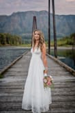 After deciding quickly to do an outdoor vow renewal, the rush was on to find a dress I felt good in. This dress was perfect! It felt higher quality than the price point. It was well-lined, and the tulle helped to make the skirt full. The lace detailing was beautiful. The length worked well for my 5'8 height. Would recommend! - Kristen L.
