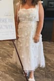 Wore this for my bridal shower and received sooo many compliments. It really was a perfect shower dress. I ended up ordering in an XXL and it fit much better, as the XL wouldn't zip around my chest. Zero stretch. The XXL top was kind of weird though, so much extra material. I ended up using some fabric tape to fold the top over and make it more of a cowl neck. I was nervous the straps would rip based on some other reviews, but no issues! I really had it tied super tight too, and it didn't budge. Very sheer. - Sarah S.