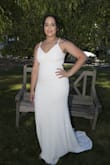 It fits really well, it fits well. I wasn't too keen on the adjustable straps, but I had the seamstress fix it and cut a little bit off the hem, and it turned out perfectly! - Emily S.