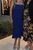 The material is a little bit thicker than expected, but the stretch in this dress was amazing! I got a Medium and felt like it hugged in all the right places! I wore a strapless bra and just pulled it down a little in the back, and it worked great! Didn't have to worry about pulling it up too often, either with 36DD chest, which I was thankful for! - Beth A.