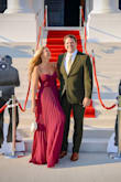 Loved this dress and the color was really quite flattering on my skin tone. The bodice is very fitted but the skirt is loose and flowy. It is a little long for me even with heels so I will definitely need to get it hemmed for future wears. Great dress!! - Morgan K.