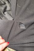 The dress ripped open at least 2 inches right below the zipper not even halfway through the wedding event! Not worth the price paid given this malfunction. Aside from the fabric malfunction, the dress did look nice- just a simple black dress. - Briannah F.