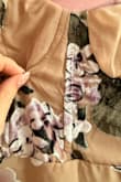 Overall a nice dress. The color was a little darker in person than in the photos. Only downside was it arrived damaged. At first it looked like a wrinkle but at closer look it was ripped. - Ellen M.