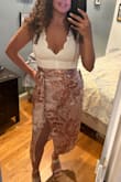 Love this bodysuit. Sexy and flattering. I'm usually in between a S and M, but got a small because I wanted it to fit tight. I paired it with the wrap skirt. Very pretty combo. As always, super fast shipping and great customer service. - Elizabeth B.