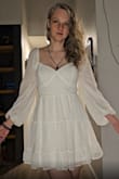 I wanted a dress that would be light enough for the 108 degree weather in Vegas, cool/snow white for the Backstreet Boys Millennium Album vibes, and had an open back to show off my new tattoo. I was skeptical this might look too young on me, but it ended up being my favorite! Has a very sweet vibe :) - Elizabeth F.