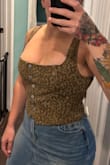 Such a cute top. I feel like it fits true to size. I'm not super busty, so I had no issue in that department. - Christine F.