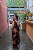 I received so many compliments on this dress! I love the cowl back and long slit up the front. This pattern was perfect for a fall wedding. The large was too big for me (mainly around the armpit and chest area), so I went down to a medium and it fit perfectly! As for it being see through like some other reviews say: I can see how on a solid color this may be an issue, but I think the floral pattern kind of masks it; I didn't have any issues with it showing anything. - Francesca A.