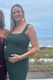I wore this dress to a wedding at 22 weeks pregnant and it was perfect! It accentuates the baby bump but also still has a thick enough fabric that I don't feel self conscious in it. I haven't tried it on while not pregnant but I imagine it would fit really well then too! - Frances B.