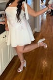 Ordered an XL and it fit perfectly! Loved that the shoulder straps the bow could be tied to my liking. Since I'm in between sizes, the bottom of the dress worked well. The top area, I could adjust by how tight I wanted the bows. - Scarlett M.