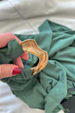 This dress is poorly made, with terrible, cheap material; the colour is not as pictured, it is more of a dark green. I thought I received the wrong order (it's that different), and the gold accessory is SO cheap and hollow that I could easily break it in half if I tried. This dress likely cost $20 or less to make and is wayyyyyy too overpriced for the reality of what it is. I ordered two other dresses, which I am happy with, but I do believe this site is a hit-or-miss. If you are going to buy a dress from lulus, I would highly recommend only going for the ones that others have reviewed. - Chanelle M.
