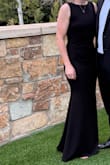 I loved this dress for a formal wedding (men wearing tuxes). I felt beautiful and was comfortable wearing it allll night. I had it hemmed about 2 inches and had heels on to help, and turned out great. The material felt more expensive than the price, which is also a plus. I would recommend finding some good silicone boob covers since the back is open, and with the snug fit on top, they all stayed in place. - Martha B.