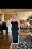 The dress fit like a glove. Very flattering on the figure. I sized up one because I felt it was a little too tight and I would have trouble sitting. Love the fabric. No need for a bra it held you in place! Absolutely love this dress. - Gwen H.