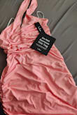 Seriously? Neon salmon pink, and rubbery instead of cloth, and breathable material. - Hilda C.