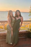 The dress, which is a vibrant emerald green silk extremely stunning. I received numerous compliments on it, and it was very comfortable to wear all day. - Jemimah T.