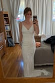 The open back is beautiful!! This dress fit me so well, but I would have to get the straps adjusted as they were falling down. The beading is beautiful, and it didn't rub against the inside of my arms! - Kaitlynn W.