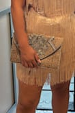 I bought this bag for my vow renewal, and it is so cute. The beading makes it feel very luxe, and the size is perfect for a night out. I was able to carry my phone, small wallet, and other misc items for a night out with my family.

I found the strap a little uncomfortable, but it could have been due to my dress strap being in the same spot. - Angelina B.