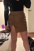 Material feels cheap and plastic like. It looks cute and I like the slit up the thigh. It's a bit big at the waist. - Amy M.