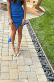 A bit loose, was able to sew it to fit better. The colour in the photo is lighter than the actual dress. It's a darker shade of blue. The sash was a bit loose in the front, placed it towards the back for a cleaner look. - Carolyn Y.