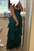 I'm 5'2" and it was a little long even with 3 inch heels. But loved the dress! The zipper was always getting stuck - Sierra J.