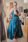 I purchased this for a black tie event, and it's going to work perfectly! 
As other reviewers said, I would definitely size up. I'm typically a size 6 (small), and the medium for great. It looks turquoise in the photo, but it's definitely more emerald green in person. - Christina H.