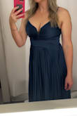 The dress is beautiful. Came with a few strings in the bust line that needed burned off to prevent raveling. Also, one of the straps was not sewn great and came apart prior to my event and had to be tied. - Megan B.