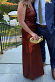 The dress fit was great! I am a little short, so I did get it hemmed, and I also got the breast area taken in a little bit as it was a little loose. I loved the color and the overall look. My only concern was that as soon as something spilled on the dress, it dry stained because of the satin. I even tried to wash it at the wedding! Otherwise, I would purchase again. - Anet M.