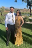 The dress is beautiful, and I've received several compliments. The fabric is nice, but the lining fabric is warm. It fits true to size at the bust, but it's very long. I had to cut one of the layers. Overall, I'm happy with the purchase, and I recommend this dress for your next formal event. - Erika S.