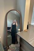 I sized up to a large because my bust is a 32 H. The dress needed to be altered, and beware the ruffles increase the alteration price!! The straps were a little long as well and had to be altered. Would recommend getting a size up if in between sizes. I ordered for a wedding, but the dress code was a little more casual than expected, so I ended up not wearing it. Happy to have it in my closet for a future event! It is very flattering. - Rylee E.