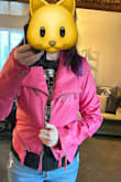 The good: This jacket is the same color as the picture, and it's gorgeous. The fabric feels good and looks good. The zippers and overall look do not feel or look cheap IMO. The bad: It is snug just as the others said. I was okay with that bc I wanted it as a cropped/fitted jacket, so I ordered the Large, knowing the XL is probably what would "fit." The large could zip if I really stressed into it, but I did not. 
What was weird was the sleeves! They're oddly wide and so long! They feel like they belong on a totally different jacket. I am tall, I am 5'9, so if they're so long for me, then most shorter than me would definitely notice. The coat would not be warm. This is a style layer, this is def not a coat layer. 5'9, 36C, 154lbs - Brittany R.
