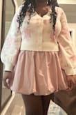 I love this outfit very much. I bought a size XL and I think it fits perfectly especially if you have a larger bust area. I paired it with the pink skort also from lulus. The sweater is very soft and warm. - Christine N.