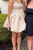I bought this dress for my daughter to wear to homecoming. It is adorable!! She's a size 4 and the small fits her perfectly. The zipper was a bit tricky, but manageable. Overall, 10/10 for us. - Kimberly N.