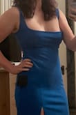 I'm kinda bloated from being a piggie and not working out for a week, and this dress is still pretty flattering! Wide set straps flatter wide shoulders and balance out hips. Thick enough to wear without a bra (which makes it comfy too) Cutout in back creates the illusion of a narrower waist. Perfect for tall girls with wide shoulders- but also wide hips, but I could see how the straps may be problematic for short girls. I'm 43, 5'10 tall, athletic but a bit fluffy, as you can see. - Lauren G.
