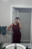 The dress is a little bit snug, but I wouldn't size up. The material is nice and thick and really snatches everything in! - Victoria S.