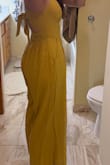 This just really missed the mark. The boob area is saggy, the back elastic waistband looks cheap and also sags, the back tie is incredibly uncomfortable and is a weird length, so you can't tie a bow, but tying a knot makes it stick out, and the whole thing wrinkles horribly. - Annette L.