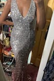 I bought this dress for a wedding and decided it was too shiny for that occasion. It's definitely a gala dress, or something more glitzy. It was a steal of a deal, though, as I got it on sale, so I don't regret buying it. The material is stretchy, so it hugs the body well. Will be perfect on someone who's pear shaped or hourglass, but generally a flattering cut. - Sherise B.