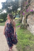 I bought this for a September wedding in the south of France. I love how flowy the skirt is and the beautiful colors. For me, this dress ran small. I am normally a size medium in Lulus dresses, but this dress was tight, so I had to exchange for a large, which fits perfectly. The undergarments have to be specific because of the gap between the chest area, but I was able to find something easily. The only negative was that the bust area was pretty itchy, so I would recommend full shape wear. - Tierney S.