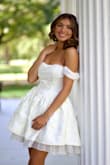 I bought the dress for my daughter for graduation and senior pictures. It fit perfectly. She put a petticoat on to give shirt more poof. The skirt lays flat without it. - Julie D.