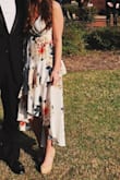 This dress was so pretty to wear to a formal! It was a little large on top, and even adjusting it didn't really help. But the pattern was beautiful and the high to low with the ruffles made it really unique! - Eliza M.