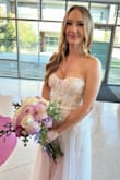 This dress was an absolute dream! I wasn't sure I'd love it just from the website photos, but I'm so glad I took a chance and ordered it. The second I tried it on, I knew it was the one. It made me feel so beautiful and ethereal. The dress is the perfect mix of romantic, a bit sexy, and fairy-like. I ordered a small and a medium and ended up going with the medium because it fit my bust better. It was comfortable to wear all day, and I didn't even have to alter it (a much-appreciated feature for short people like me). I couldn't imagine a better dress for my wedding day. - Dory B.