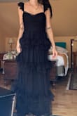 The material was amazing and it fit perfectly. Needed a steam before the event, but that's to be expected. - Scarlet V.
