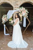 I was 9 months postpartum, breastfeeding, was recovering from severe diastasis recti and was not planning on getting married until I'd had more time to get in better shape. Then my dad got diagnosed with stage 4 cancer and we decided to throw together a wedding with only 6 weeks to plan so that my father could attend. I called the best bridal shops locally, but they were all booked out for months, as it was peak-wedding season. Plus, I felt silly spending a bunch of money on a dress when we were already a little family of 3 paying a mortgage. So I got this $100 dress in Size Large. I added a Pearl & rhinestone belt (also purchased from lulus) and sewed that to the dress. And I was very happy with it. It's a simple and timeless dress with an elegant and forgiving silhouette. I did have to get it hemmed quite a bit as I wore flats, but that's to be expected. Very happy with this dress!!! - Elizabeth T.